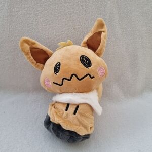 Tan and Black Stuffed Animal Toy